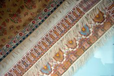 The edge of 3 shawls on display at the Castle MuseumMid C19